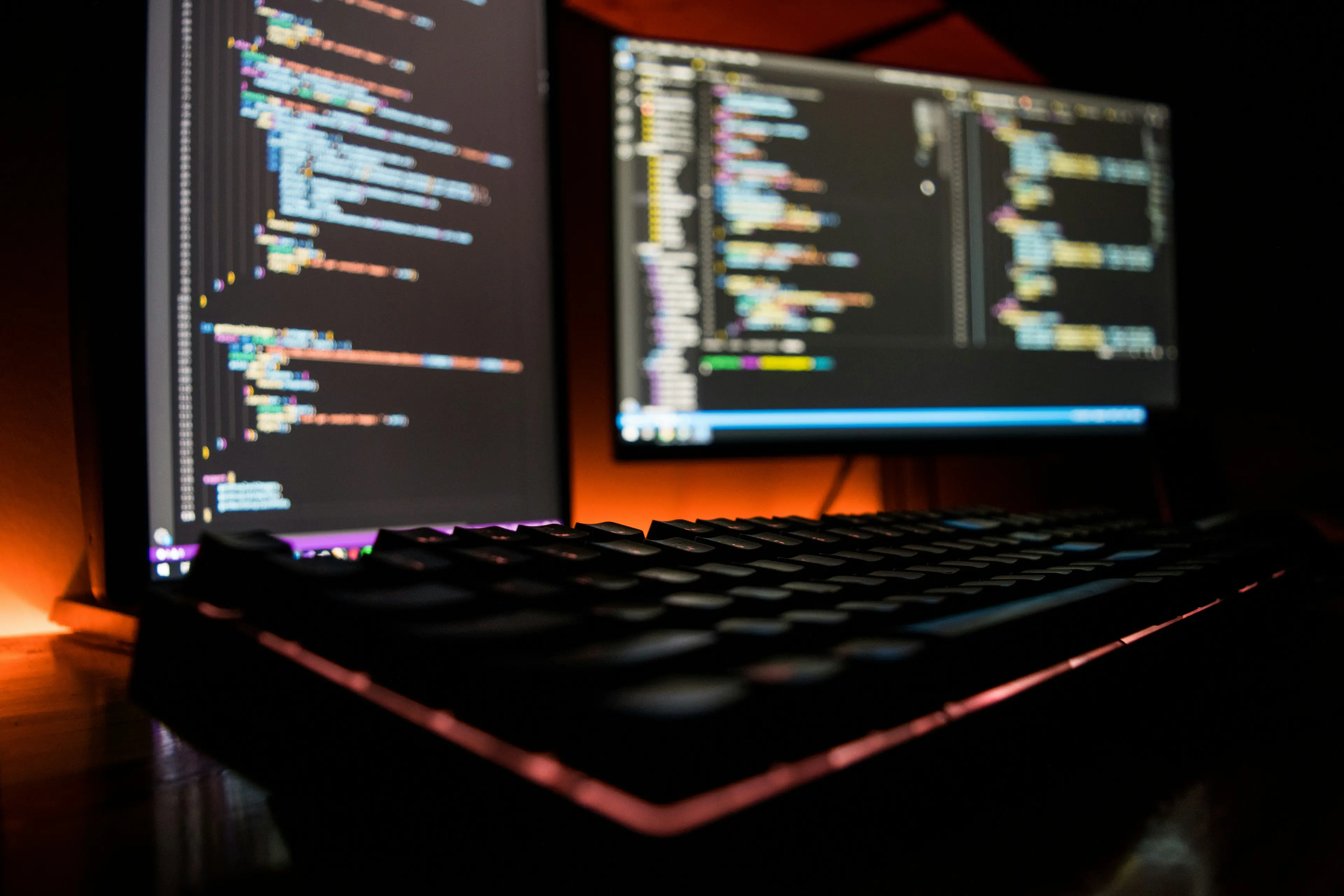Laptop and monitor displaying software development work