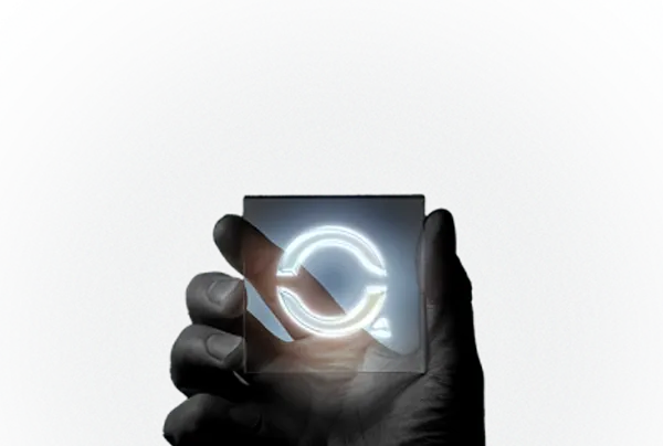 Hand holding a glowing Qblen symbol